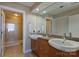 Bathroom features double sinks, granite countertops, and glass-enclosed shower for a luxurious feel at 505 E 6Th St # 804, Charlotte, NC 28202