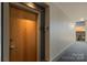 Hallway featuring unit number and end-of-hall window with treetop and city views at 505 E 6Th St # 804, Charlotte, NC 28202