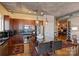 This modern kitchen features sleek wood cabinets, stainless steel appliances, and a stylish black countertop island with bar seating at 505 E 6Th St # 804, Charlotte, NC 28202