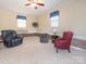 Finished basement with updated carpet, neutral paint, and several comfortable seating options at 5789 Gettysburg Nw Dr, Concord, NC 28027