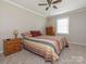 Comfortable bedroom with natural light, plush carpet, and neutral wall and trim colors at 5789 Gettysburg Nw Dr, Concord, NC 28027