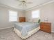 Neutral bedroom featuring a ceiling fan and natural light from two bright windows at 5789 Gettysburg Nw Dr, Concord, NC 28027