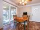 Cozy dining area with natural light, access to screened porch, and breakfast nook at 5789 Gettysburg Nw Dr, Concord, NC 28027