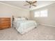 Bright main bedroom featuring a queen size bed, carpet, and neutral decor at 5789 Gettysburg Nw Dr, Concord, NC 28027