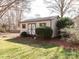 Well maintained shed in backyard offers additional storage space and design features with double doors and window at 5789 Gettysburg Nw Dr, Concord, NC 28027