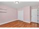 Bedroom with wood flooring, a closet, neutral walls, and recessed lighting at 5830 Kelden Walker Ln, Charlotte, NC 28269