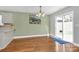 Bright dining room with hardwood floors and sliding glass door to the backyard at 5830 Kelden Walker Ln, Charlotte, NC 28269