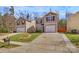 Inviting two-story home with neutral siding, black shutters, concrete driveway, and a well-kept lawn at 5830 Kelden Walker Ln, Charlotte, NC 28269