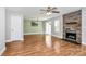 Inviting living room with hardwood floors, fireplace, and access to the dining area at 5830 Kelden Walker Ln, Charlotte, NC 28269