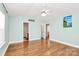 Expansive main bedroom with hardwood floors, ceiling fan, and ensuite bathroom at 5830 Kelden Walker Ln, Charlotte, NC 28269