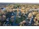 Aerial shot showcasing a neighborhood setting with tree-lined streets and beautiful homes at 6068 Gold Creek Estate Dr, Hickory, NC 28601