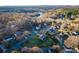 Scenic aerial view of a residential area surrounded by lush greenery and tranquil waters at 6068 Gold Creek Estate Dr, Hickory, NC 28601