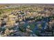 Serene aerial view of a community with lush trees, a nearby lake, and beautiful homes at 6068 Gold Creek Estate Dr, Hickory, NC 28601