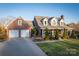 Charming brick home with a two-car garage, inviting front porch and well manicured lawn at 6068 Gold Creek Estate Dr, Hickory, NC 28601