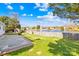 Large backyard with a fence overlooking a pond at 6325 Martin Lake Rd, Charlotte, NC 28227