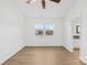 Bedroom featuring hardwood floors, natural light, and an ensuite bathroom at 6325 Martin Lake Rd, Charlotte, NC 28227