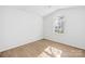 Bedroom featuring hardwood floor and large arched window at 6325 Martin Lake Rd, Charlotte, NC 28227