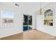 Bright bedroom with hardwood floors, a chandelier, and natural light from the large windows at 6325 Martin Lake Rd, Charlotte, NC 28227