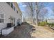 Backyard patio with a cooler and a view of the well-maintained yard and wooded area at 717 Meadow Lake Dr, Matthews, NC 28105