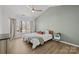 Spacious bedroom featuring vaulted ceilings, a ceiling fan, and a large window at 717 Meadow Lake Dr, Matthews, NC 28105