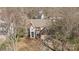 Attractive two-story home with brick and light blue siding and well-manicured front yard at 717 Meadow Lake Dr, Matthews, NC 28105