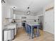 Bright kitchen featuring white cabinetry, stainless appliances, and a blue island at 717 Meadow Lake Dr, Matthews, NC 28105