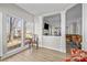 Bright living room with an adjoining sunroom, featuring hardwood floors and natural light at 717 Meadow Lake Dr, Matthews, NC 28105