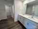 Primary bathroom featuring double sinks, white vanity, large mirror, and tile flooring at 812 N Naughton St, Chester, SC 29706