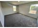 Bright bedroom with carpeted floor, window, and neutral wall color at 812 N Naughton St, Chester, SC 29706