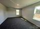 This bedroom features a sunny window, carpet flooring and a neutral color palette at 812 N Naughton St, Chester, SC 29706