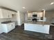 Kitchen with white cabinets, granite countertops and dark floors at 812 N Naughton St, Chester, SC 29706