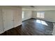 Bright living room featuring luxury vinyl plank floors and natural light from large windows at 812 N Naughton St, Chester, SC 29706