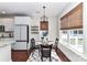 Cozy dining area near the kitchen with natural light and modern fixtures at 8412 Westmoreland Lake Dr, Cornelius, NC 28031