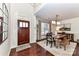 Inviting dining room featuring a stylish light fixture and ample seating at 8412 Westmoreland Lake Dr, Cornelius, NC 28031