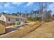 Back of the house showing the shed, greenhouse, and expansive backyard at 8742 Belt Ln, Fort Mill, SC 29707