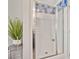 Modern bathroom featuring glass-enclosed shower, stylish tile work, and a plant for added freshness at 8742 Belt Ln, Fort Mill, SC 29707