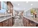 Stylish kitchen with wood cabinets, sleek counters, stainless steel sink, and an adjacent dining area at 8742 Belt Ln, Fort Mill, SC 29707