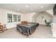 Spacious basement with a pool table covered, and an office area at 9022 Taunton Dr, Huntersville, NC 28078