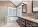 Bathroom with double vanity, granite countertops, tiled floors, and separate shower and tub at 9022 Taunton Dr, Huntersville, NC 28078