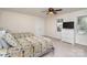 Bedroom with two twin beds, ceiling fan, natural light, and a dresser with TV at 9022 Taunton Dr, Huntersville, NC 28078