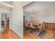 Bright dining room with hardwood floors, a chandelier, and space for a large table at 9022 Taunton Dr, Huntersville, NC 28078