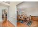 Bright dining room with hardwood floors, a chandelier, and space for a large table at 9022 Taunton Dr, Huntersville, NC 28078