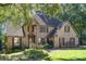 Traditional brick home with mature landscaping at 9022 Taunton Dr, Huntersville, NC 28078