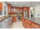 Functional kitchen featuring stainless steel appliances, granite countertops, and ample storage in custom cabinets at 9022 Taunton Dr, Huntersville, NC 28078