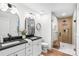 Modern bathroom featuring a double vanity, glass shower, and stylish fixtures at 908 Coventry Rd, Kannapolis, NC 28081