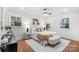 Bright bedroom featuring hardwood floors, ceiling fan, and well-lit windows at 908 Coventry Rd, Kannapolis, NC 28081