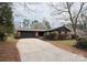 Charming brick home with a spacious driveway and well-maintained landscaping at 908 Coventry Rd, Kannapolis, NC 28081