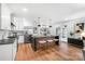 Modern kitchen with stainless steel appliances, granite countertops, and a large island at 908 Coventry Rd, Kannapolis, NC 28081