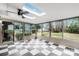 Bright sunroom with checkerboard floors, skylights, and views of the backyard at 908 Coventry Rd, Kannapolis, NC 28081