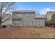 Spacious backyard with gray two-story home and fence at 944 Treasure Ct, Fort Mill, SC 29708